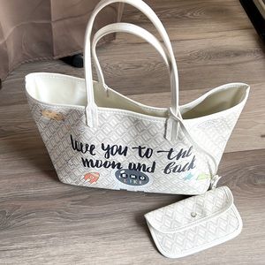 Korean brand EMO graffiti plasticized tote bag with attached small purse.